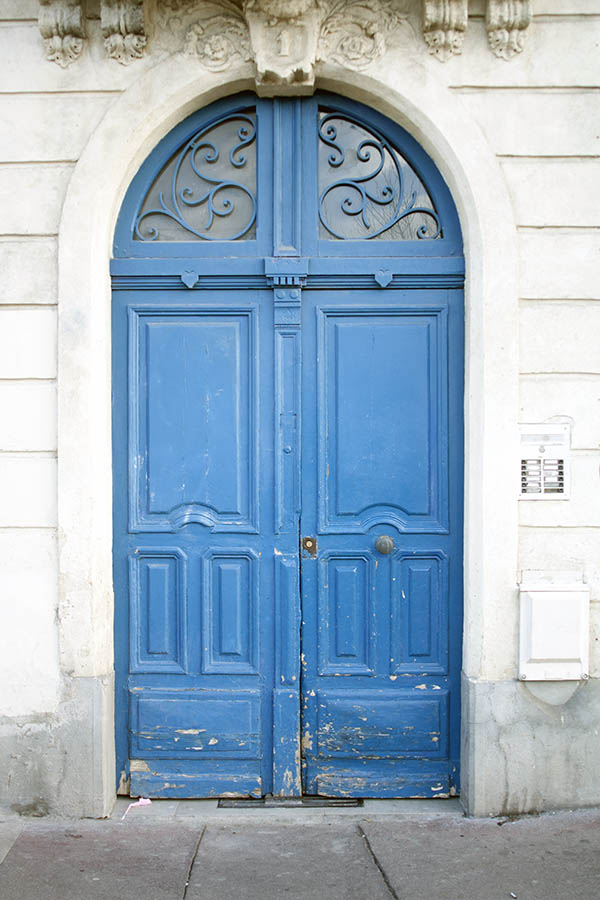 Photo 02153: Worn, panelled, light blue double door with fan light