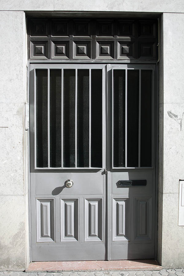 Photo 03293: New, panelled, grey, metal door with glass pane and sidepiece