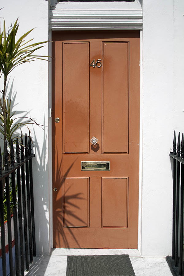 Photo 04485: Panelled, light brown door
