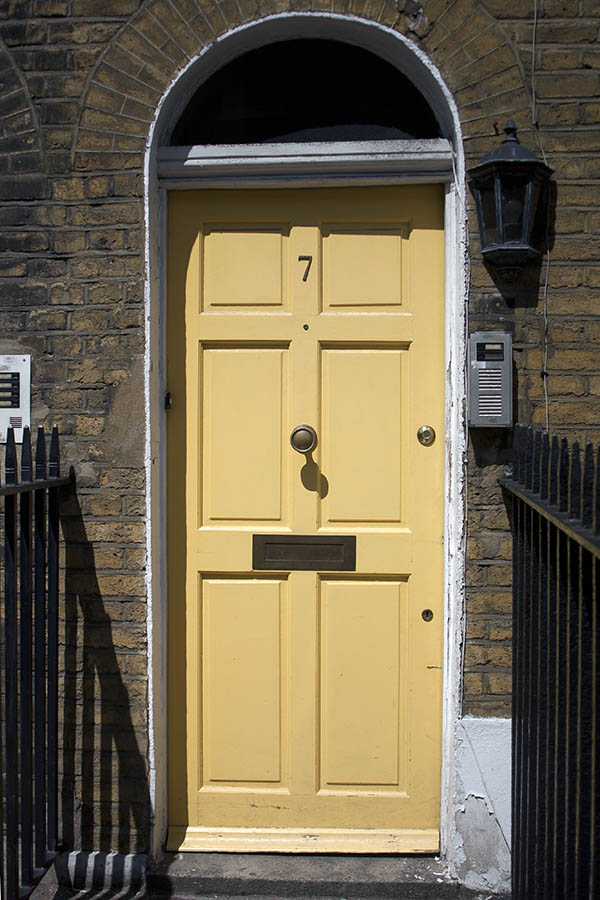 Photo 04581: Panelled, light yellow door with fan light