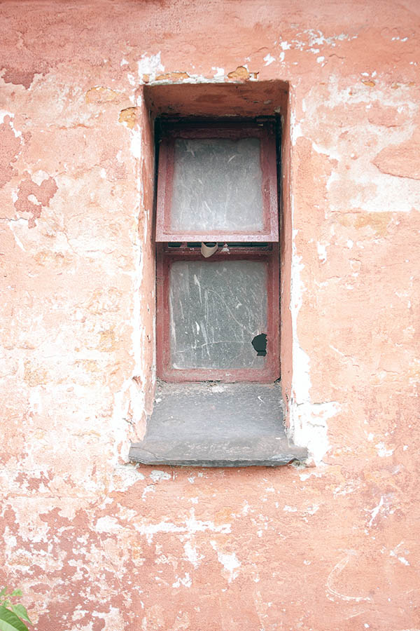 Photo 06314: Little, worn, red metal window with two frames