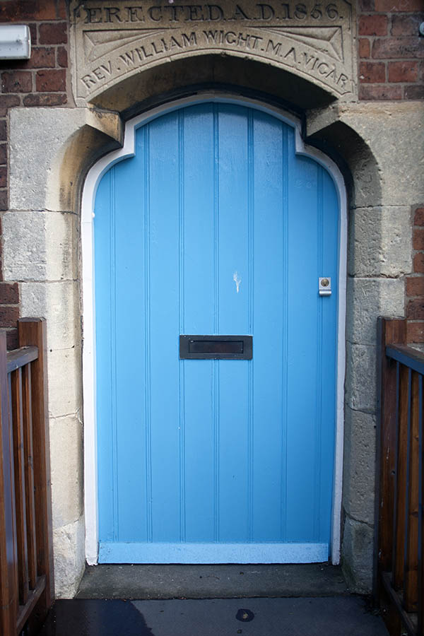 Photo 06576: Formed, light blue door with white casing