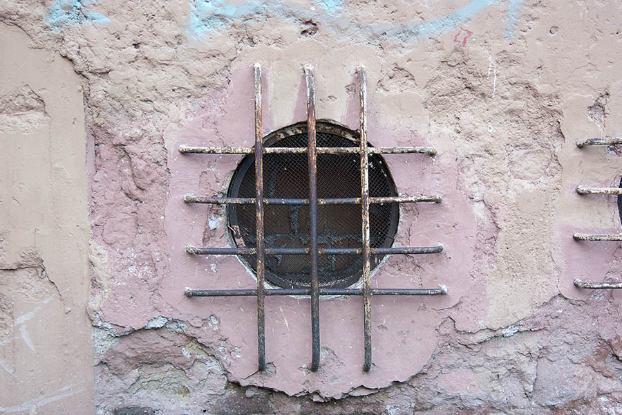 Photo 08184: Barred, brown, round window