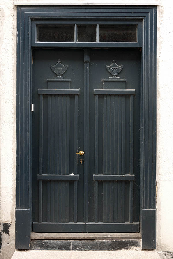 Photo 08825: Carved, panelled black double door with top window