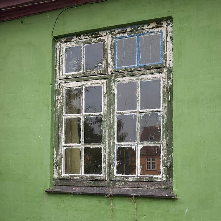 Photo 09073: Worn, green window with four frames and 16 panes