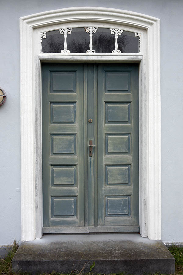 Photo 09689: Worn, panelled, teal double door with fan light