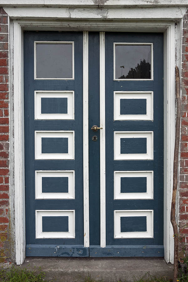 Photo 09706: Worn, panelled, blue and white double door with door lights