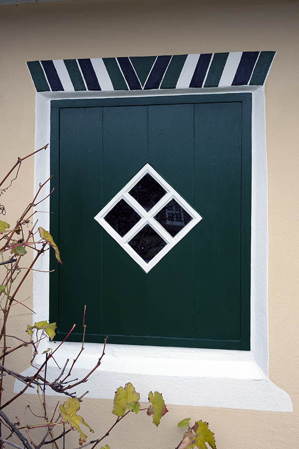 Photo 09758: Green and white trapdoor made of planks with a diamond-shaped door light