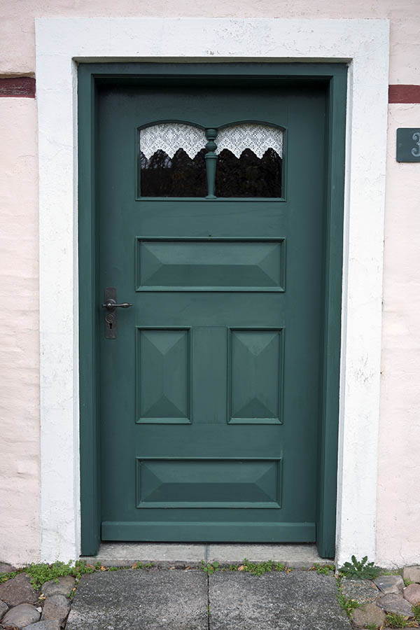 Photo 09778: Panelled, green door with Snderho door light