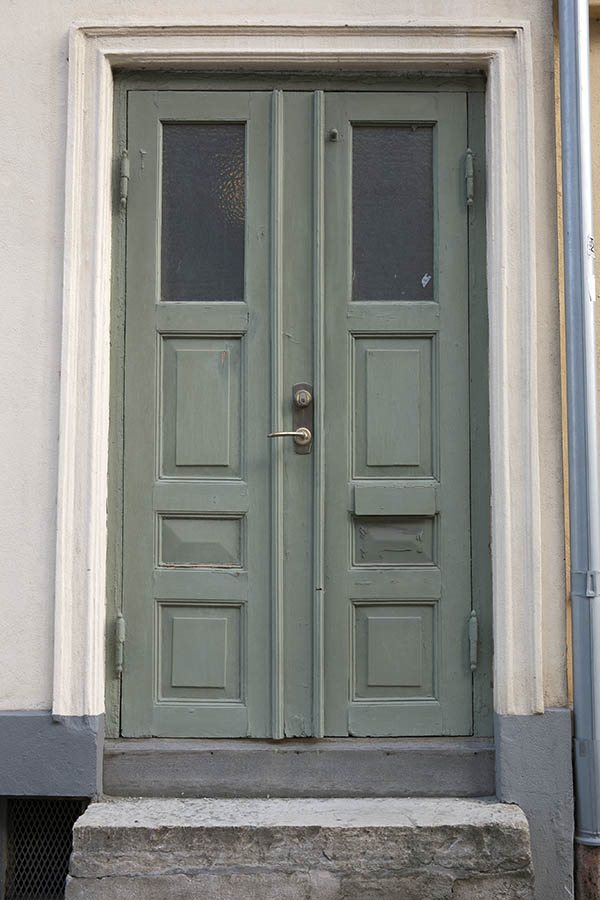 Photo 10039: Narrow, panelled, green double door with door lights