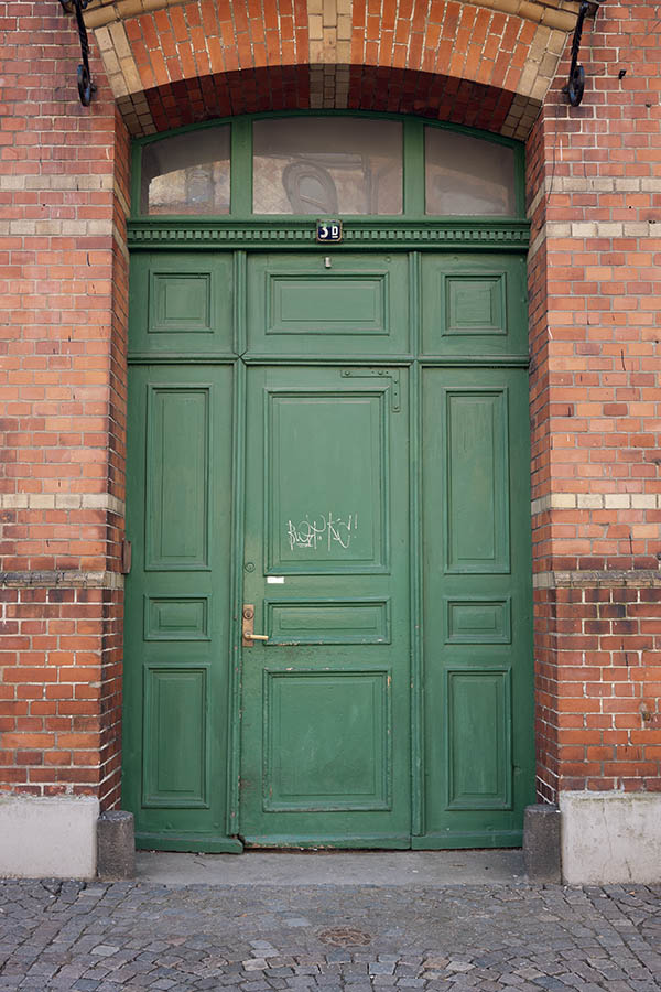 Photo 10162: Carved, panelled, green door with sidepieces and fan light