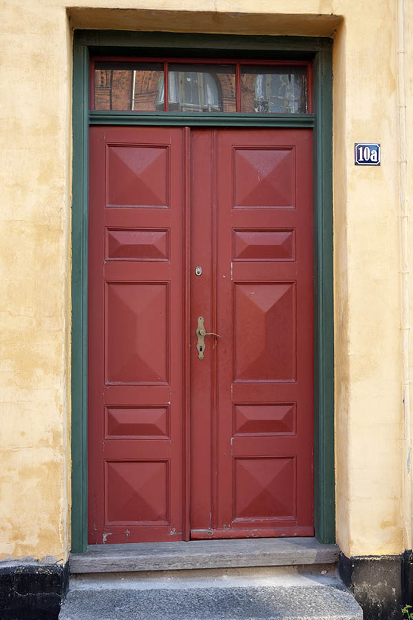 Photo 10796: Panelled, red double door with top window