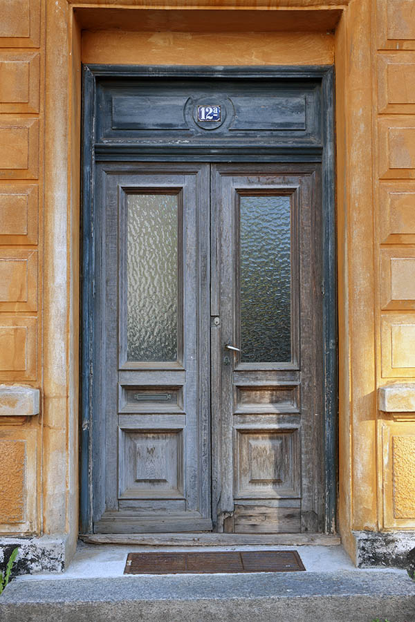 Photo 10799: Worn, panelled, teal, unpainted and brown double door with door lights
