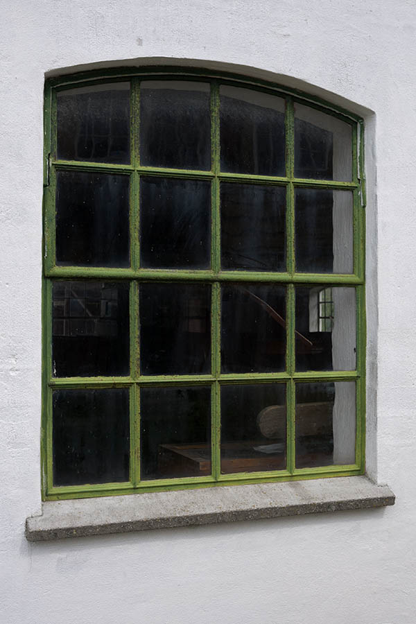 Photo 11135: Formed, green metal window with 16 panes