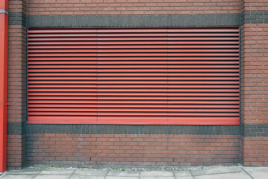 Photo 11404: Large, red window with ventilation grating