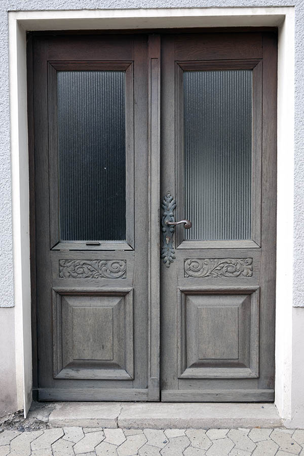 Photo 11859: Worn, carved, panelled, unpainted double door with door lights