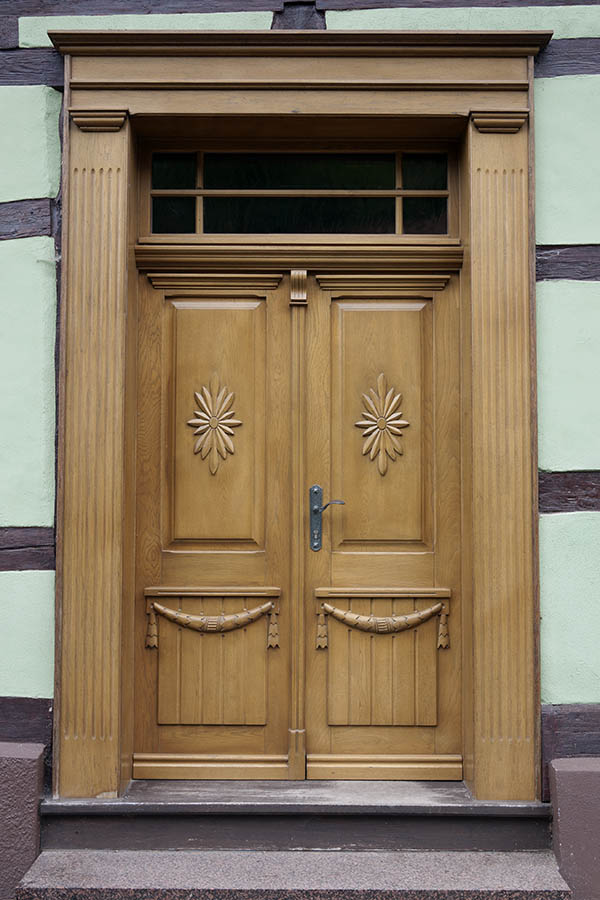 Photo 12402: Carved, panelled, lacquered double door with top window and pilaster
