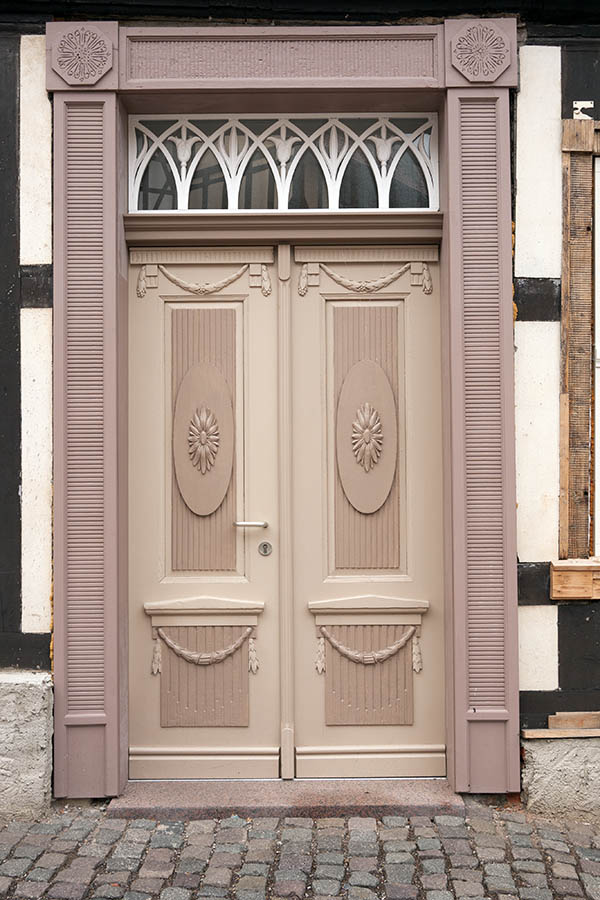 Photo 12452: Carved, panelled, light yellow and pink double door with top window