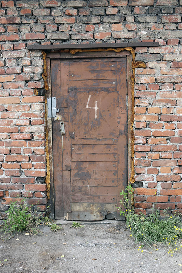 Photo 12830: Worn, lopsided, panelled, rusty, brown door