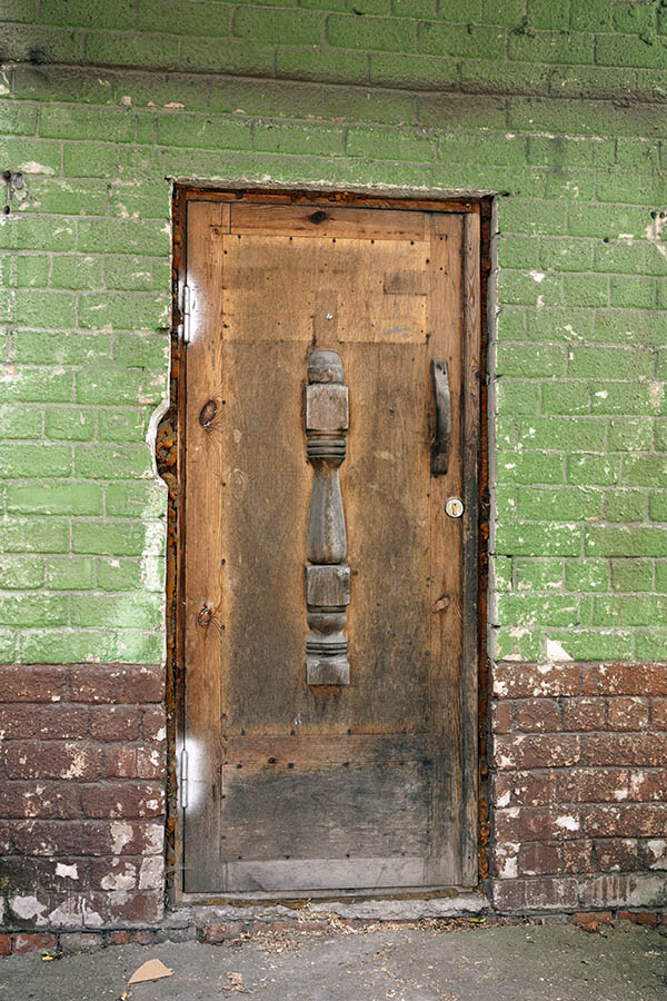 Photo 12901: Worn, carved, panelled, unpainted door