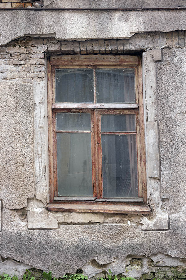 Photo 13330: Worn, lopsided, brown, unpainted window with three frames and five panes