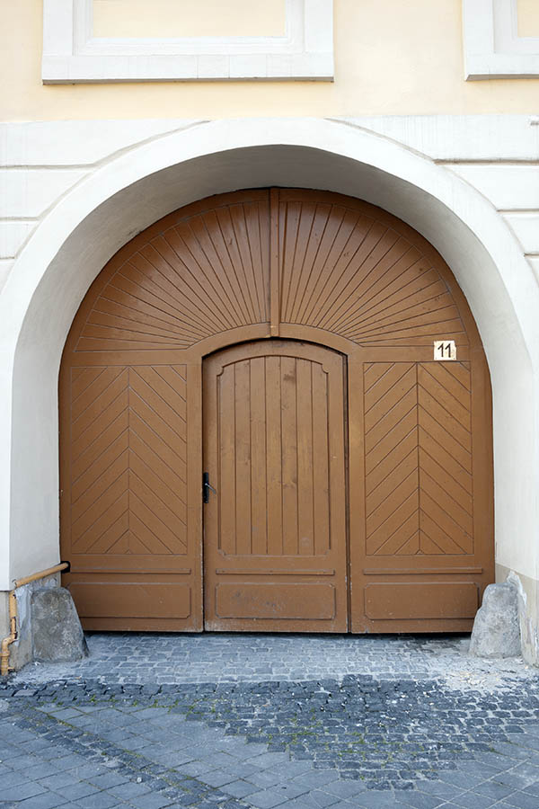 Photo 14395: Panelled, formed, light brown gate with minor door