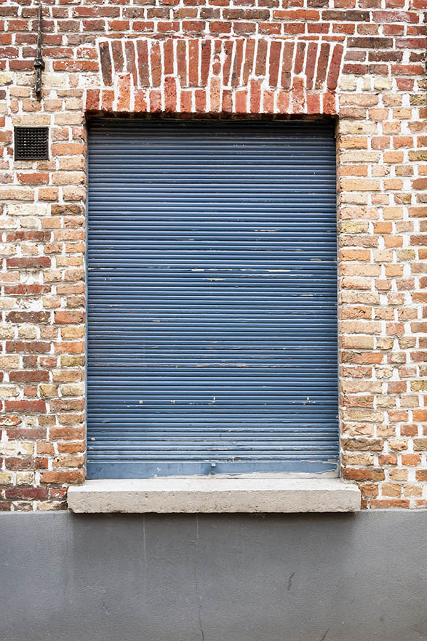 Photo 15690: Worn, blue security shutter. .