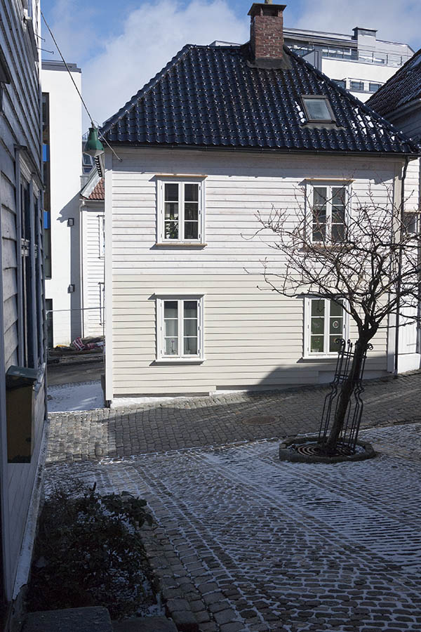 Photo 16900: Facade of white wooden house with four white windows and black roof