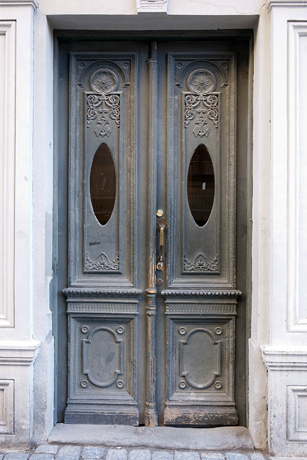 Photo 17686: Worn, panelled, carved, grey double door with oval door lights