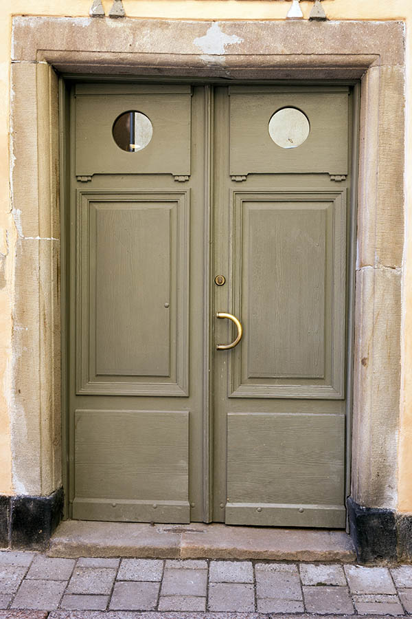 Photo 17923: Lopsided, panelled, carved, light green double door with formed, round door lights