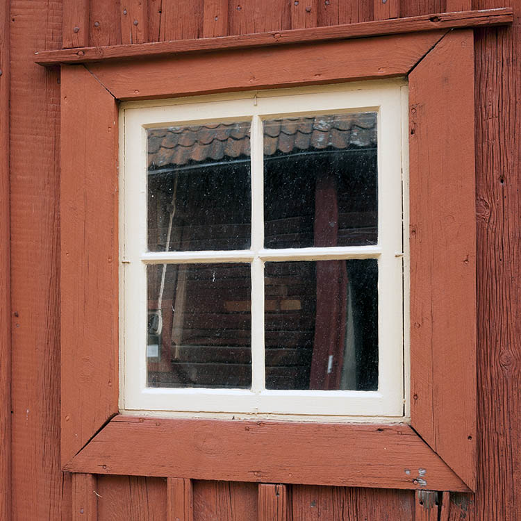 Photo 18143: Little, white window with four panes in a red frame