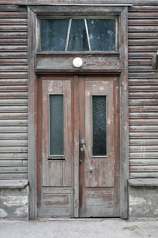 Photo 20114: Worn, panelled, unpainted and brown double door with top window