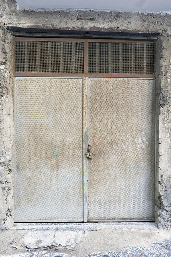 Photo 23894: Rusty, grey, metal gate with top window