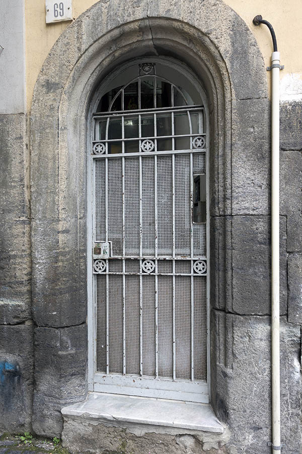 Photo 23947: Formed, grey metal door with lattice