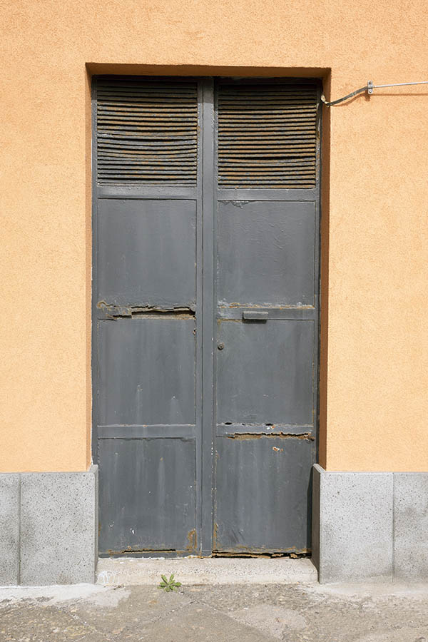 Photo 23973: Decayed, grey metal double door with ventholes
