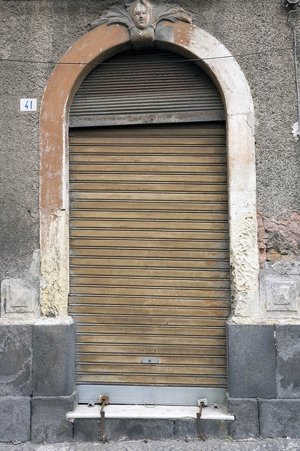 Photo 23994: Decayed, brown security shutter