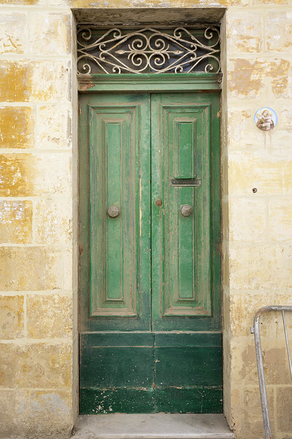 Photo 24069: Worn, panelled, green double door with latticed top window