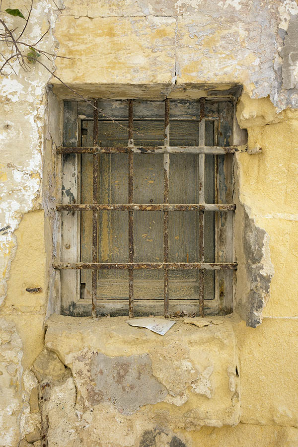 Photo 24088: Decayed, barred, rusty, brown window with one pane