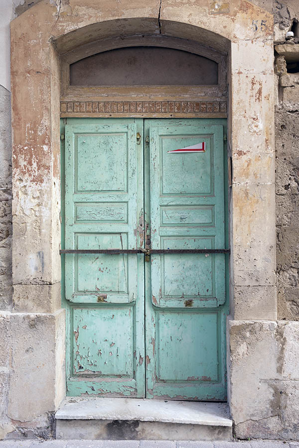 Photo 24392: Worn, panelled, light green double door with blocked fan light