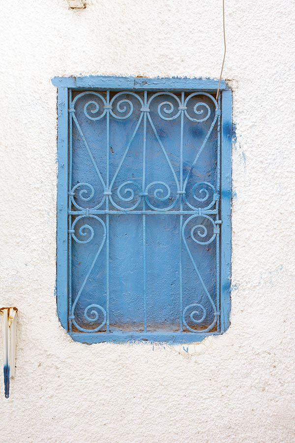Photo 24526: No window. A latticed, light blue indenture in a roughcasted, white wall