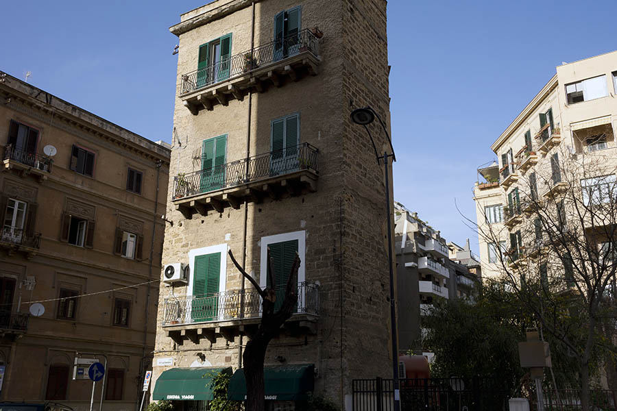 Photo 24620: Facade with a light brown, lonely tower in the middle of residential property