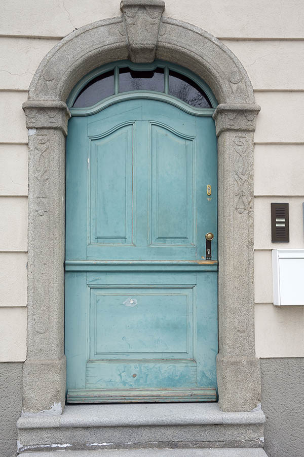 Photo 24953: Wide, worn, panelled, formed, light blue door with fan light