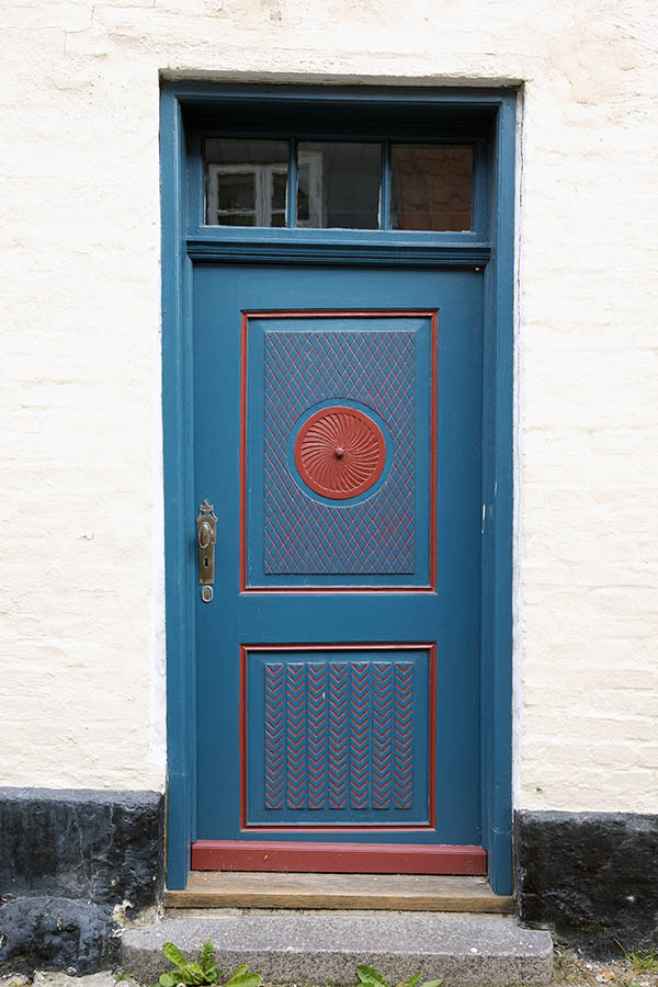 Photo 25206: Lopsided, panelled, carved, blue and red door with top window