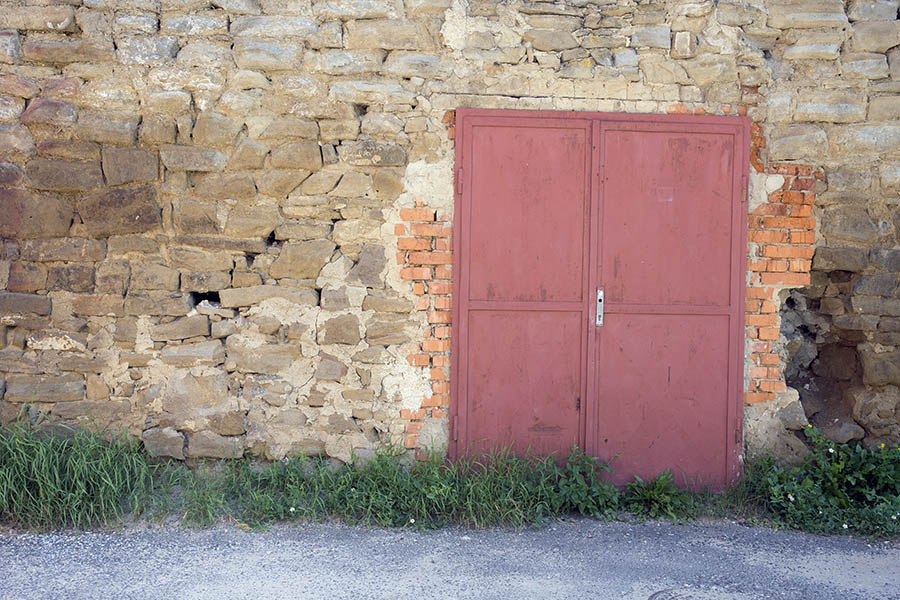 Photo 25442: Stone wall facade with a pink metal plate double door