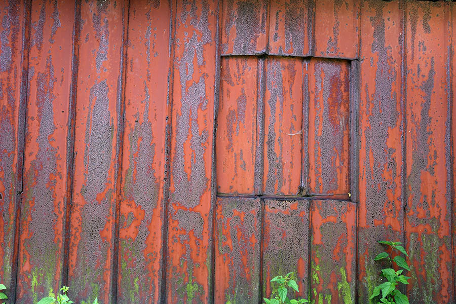 Photo 25448: No window: Facade with red and rusty metal plates and a window hole