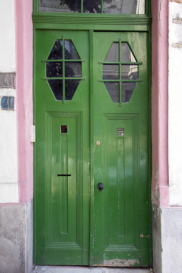 Photo 25730: Panelled, carved, green double door with hexagonal, barred door lights and top window