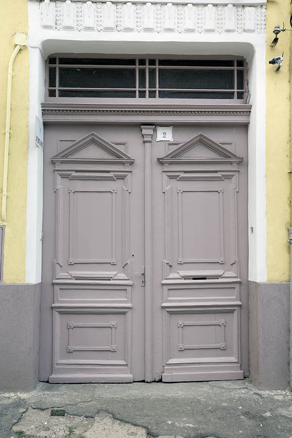 Photo 25790: Panelled, carved, grey gate with top window