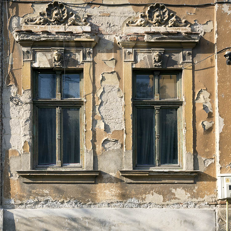 Photo 25863: Two green, carved windows with four frames each