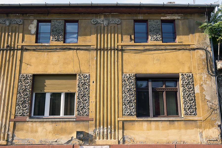 Photo 25868: Yellow, plastered facade with six windows