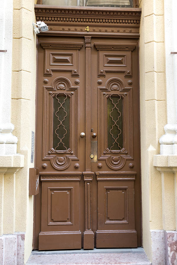 Photo 26078: Panelled, carved, light brown double door with latticed door lights and fan light